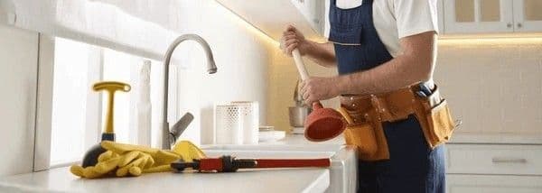 Drain choke clearing work in a Singapore kitchen